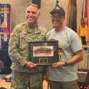 Col. Stephen Tanner, Director of the Army Recovery Care Program presented Sgt. 1st Class David Hong with the Heart of the Team award voted on by his fellow athletes