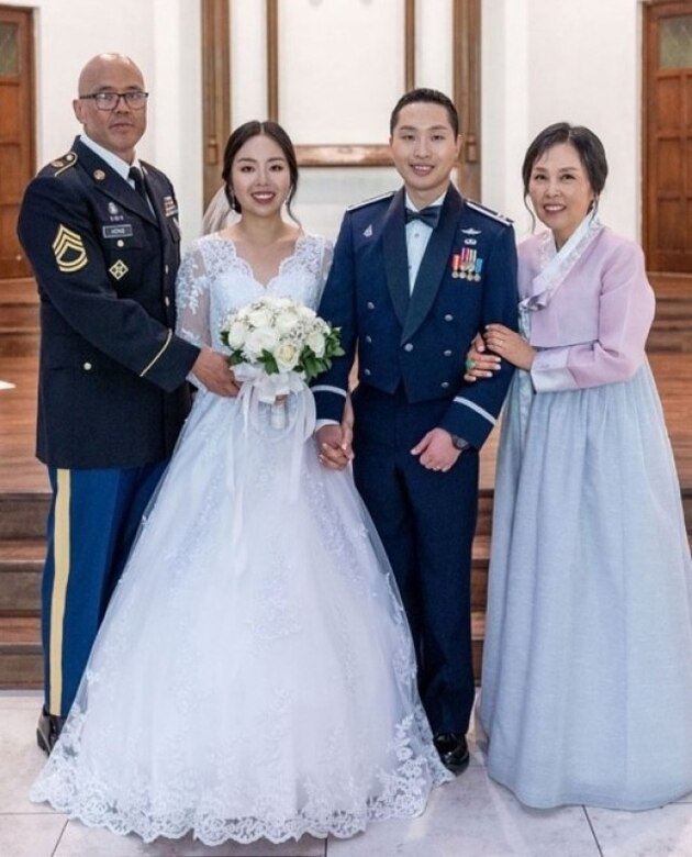 Sgt. 1st Class David Hong and his wife Monica with their daughter and son-in-law.
