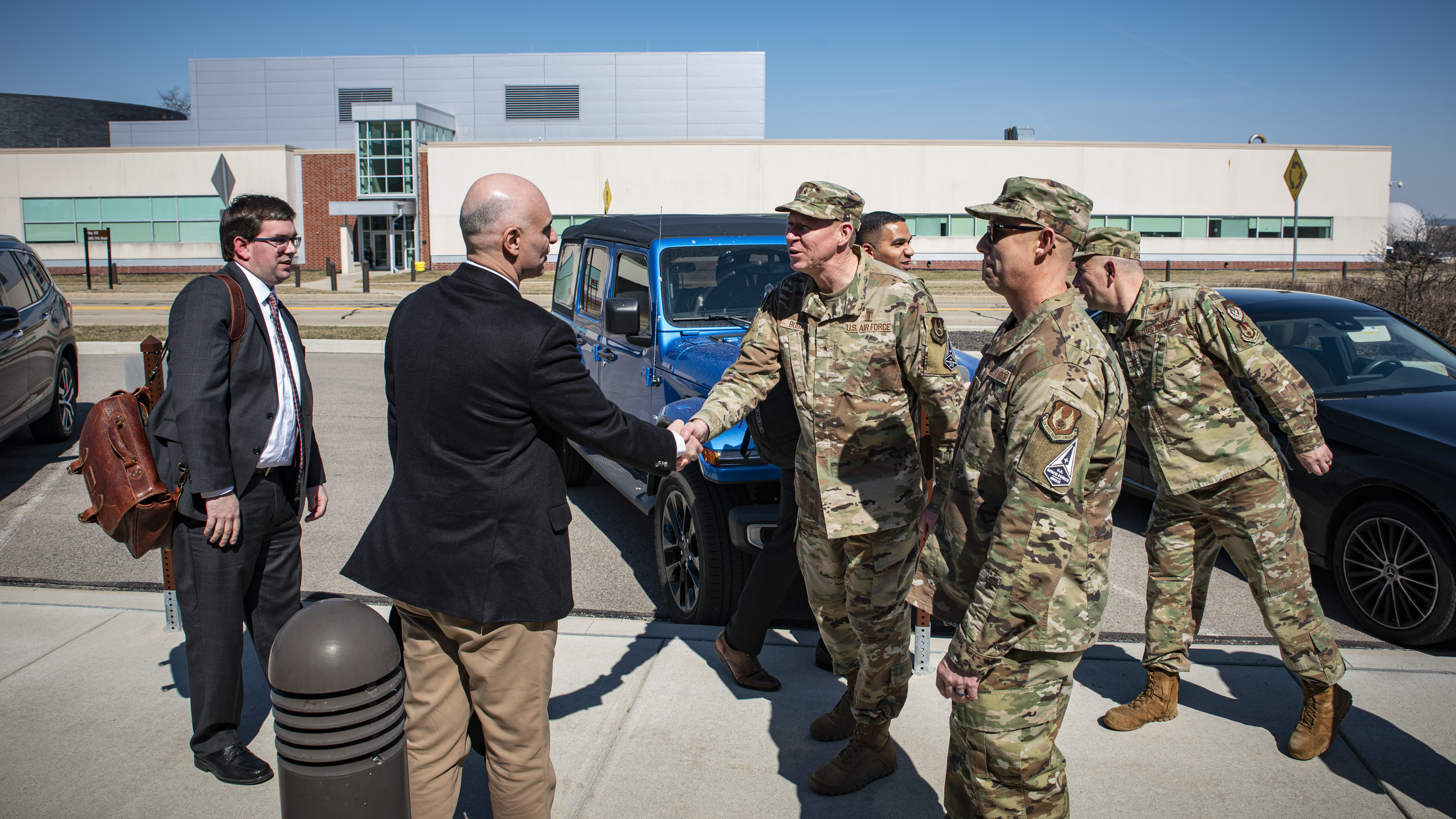Leaders from the Air Force Research Laboratory’s 711th Human Performance Wing greet Purdue University leaders prior to a tour of several facilities at Wright-Patterson Air Force Base, Ohio, March 11, 2025. The U.S. Air Force School of Aerospace Medicine hosted Purdue leaders in honor of a new partnership that expands educational opportunities for Airmen and Guardians. (U.S. Air Force photo / Richard Eldridge)