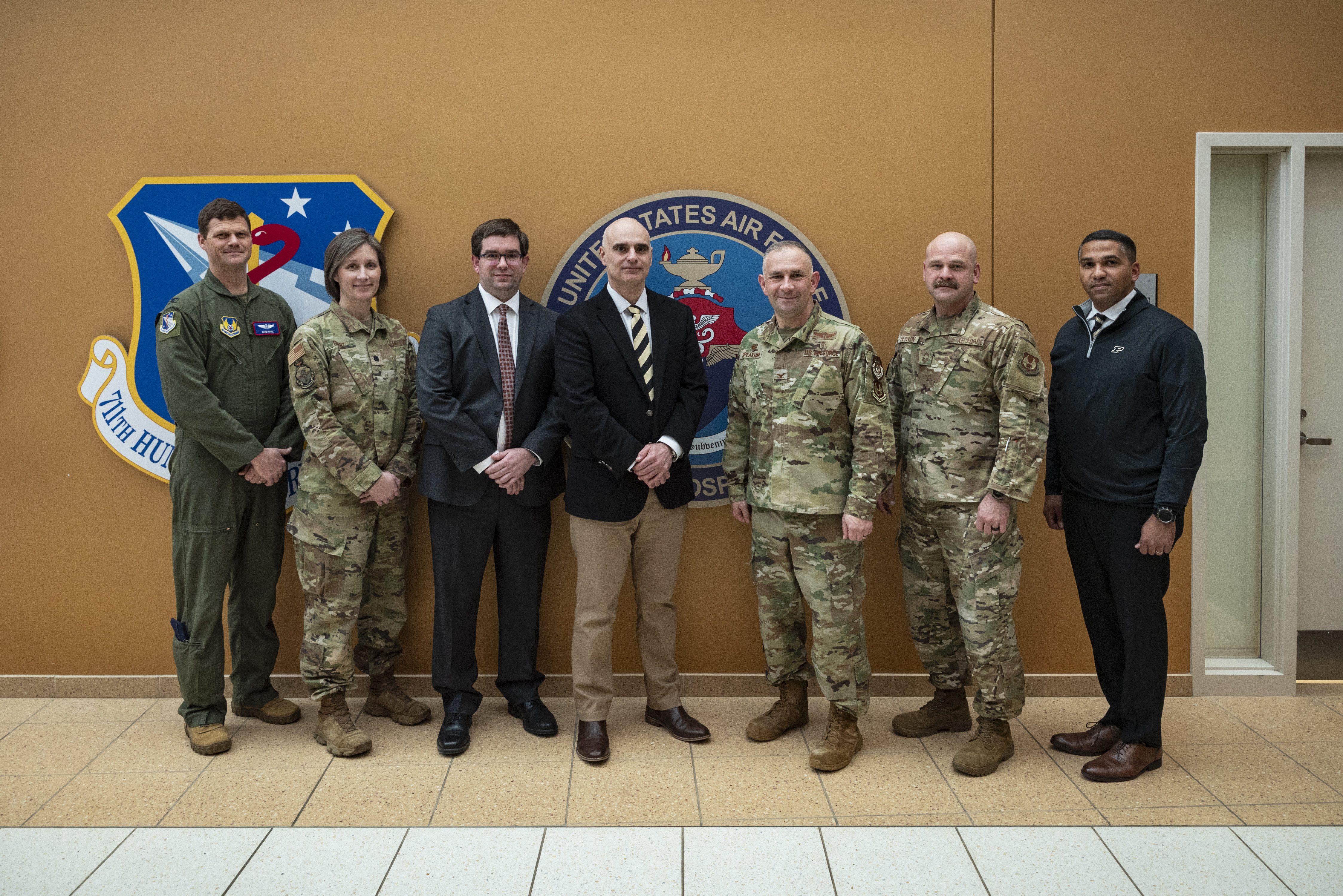 Leaders from the U.S. Air Force School of Aerospace Medicine, or USAFSAM, and Purdue University pose during a tour of several 711th Human Performance Wing facilities at Wright-Patterson Air Force Base, Ohio, March 11, 2025. USAFSAM hosted Purdue leaders in honor of a new partnership that expands educational opportunities for Airmen and Guardians. (U.S. Air Force photo / Richard Eldridge)