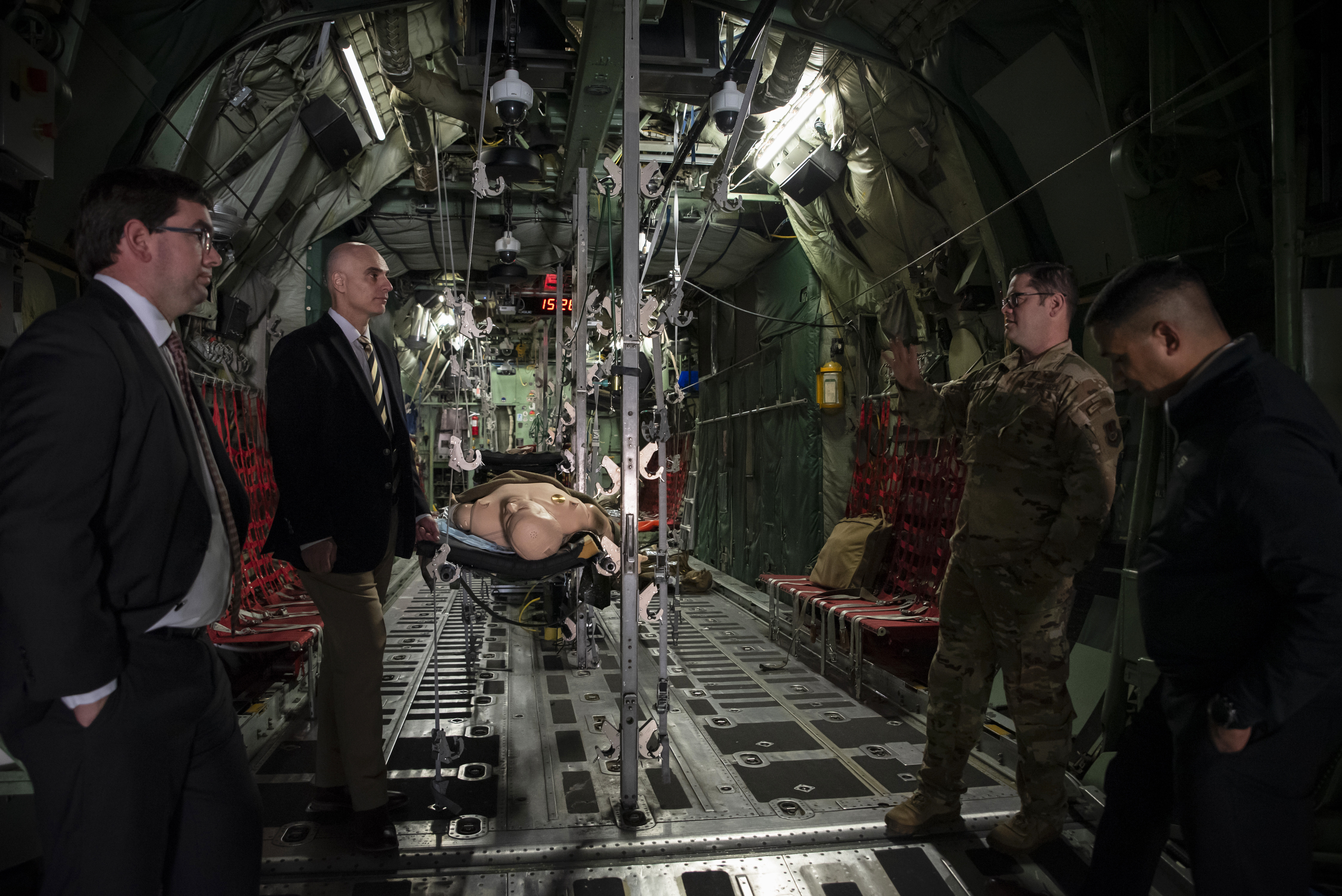 Leaders from Purdue University view a C-130 training aircraft, part of the En Route Care Training facility, during a tour at Wright-Patterson Air Force Base, Ohio, March 11, 2025. The U.S. Air Force School of Aerospace Medicine hosted Purdue leaders in honor of a new partnership that expands educational opportunities for Airmen and Guardians. (U.S. Air Force photo / Richard Eldridge)