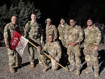 Soldiers from 1st Squadron, 303rd Cavalry Regiment pose with Col. Josh Barrow, commander, 96th Troop Command, following the 5th annual Central Washington University Army Reserve Officer Training Corp. Norwegian Foot March in Ellensburg, Wash., May 2, 2025.