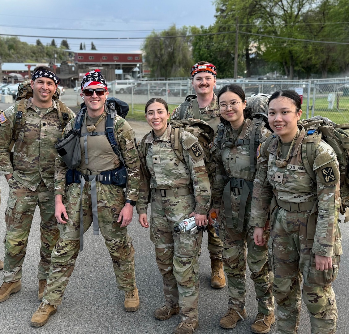 oldiers from 341st Military Intelligence Battalion pose for a photo prior to the 5th annual Central Washington University Army Reserve Officer Training Corp. Norwegian Foot March in Ellensburg, Wash., May 2, 2025.