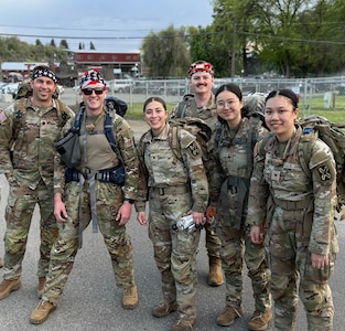 oldiers from 341st Military Intelligence Battalion pose for a photo prior to the 5th annual Central Washington University Army Reserve Officer Training Corp. Norwegian Foot March in Ellensburg, Wash., May 2, 2025.