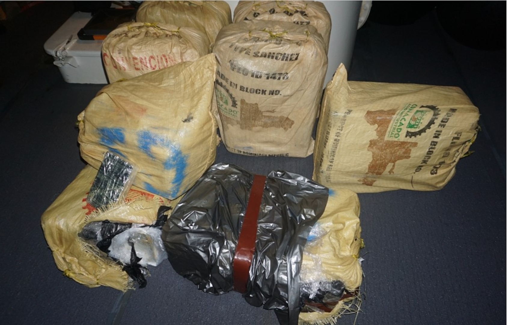 The crew of the Coast Guard Cutter Joseph Napier offloaded approximately 725 pounds of seized cocaine worth an estimated $5.4 million to Coast Guard Investigative Service and Drug Enforcement Agency Special Agents custody in San Juan, Puerto Rico, May 7, 2025. The interdiction occurred April 28, 2025, in waters north of Aguadilla, Puerto Rico, and is the result of multi-agency efforts in support of the Caribbean Corridor Strike Force. (U.S. Coast Guard photo)