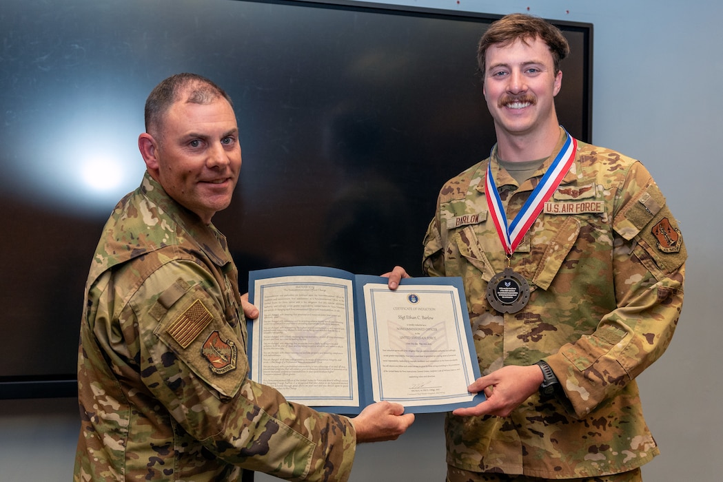 Airmen at induction ceremony.