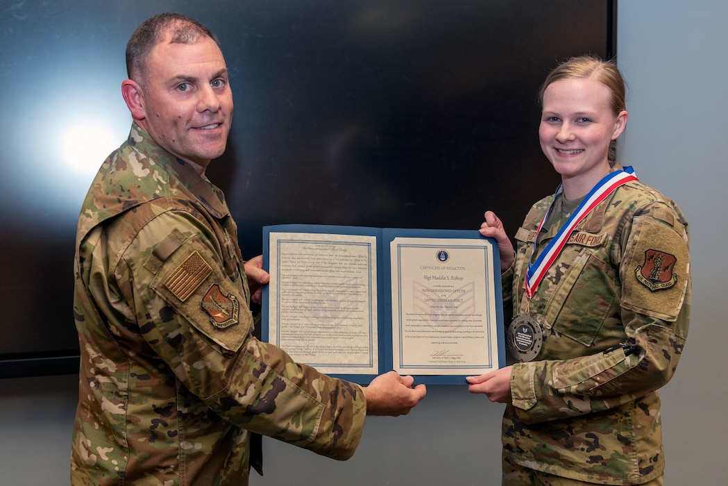 Airmen at induction ceremony.