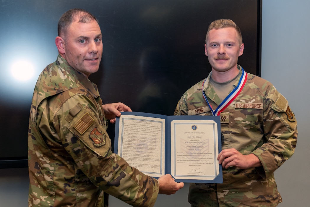 Airmen at induction ceremony.