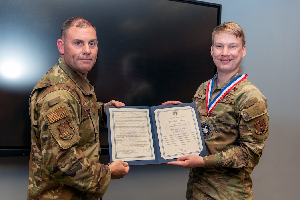 Airmen at induction ceremony.