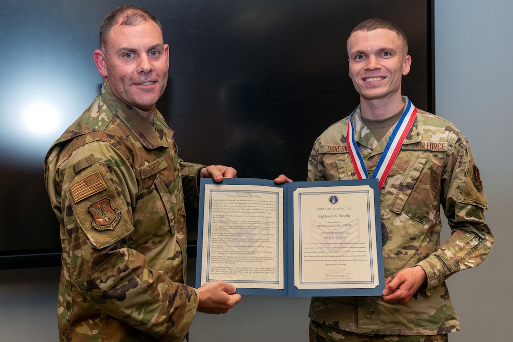 Airmen at induction ceremony.