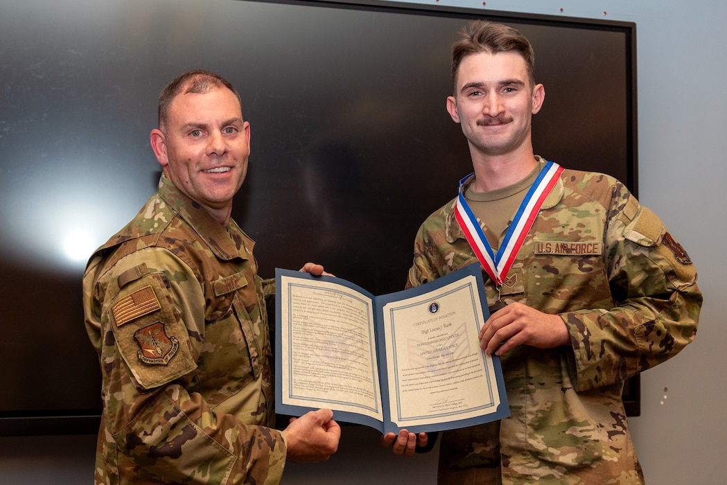 Airmen at induction ceremony.