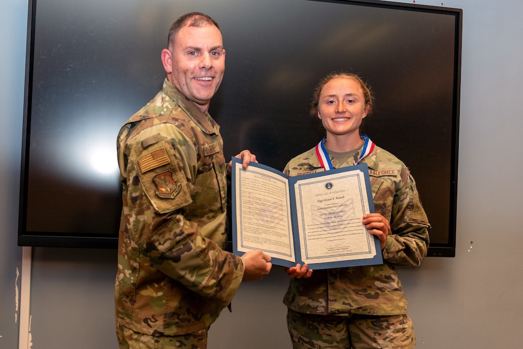 Airmen at induction ceremony.