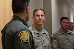 U.S. Army Soldier meeting Border Patrol member.
