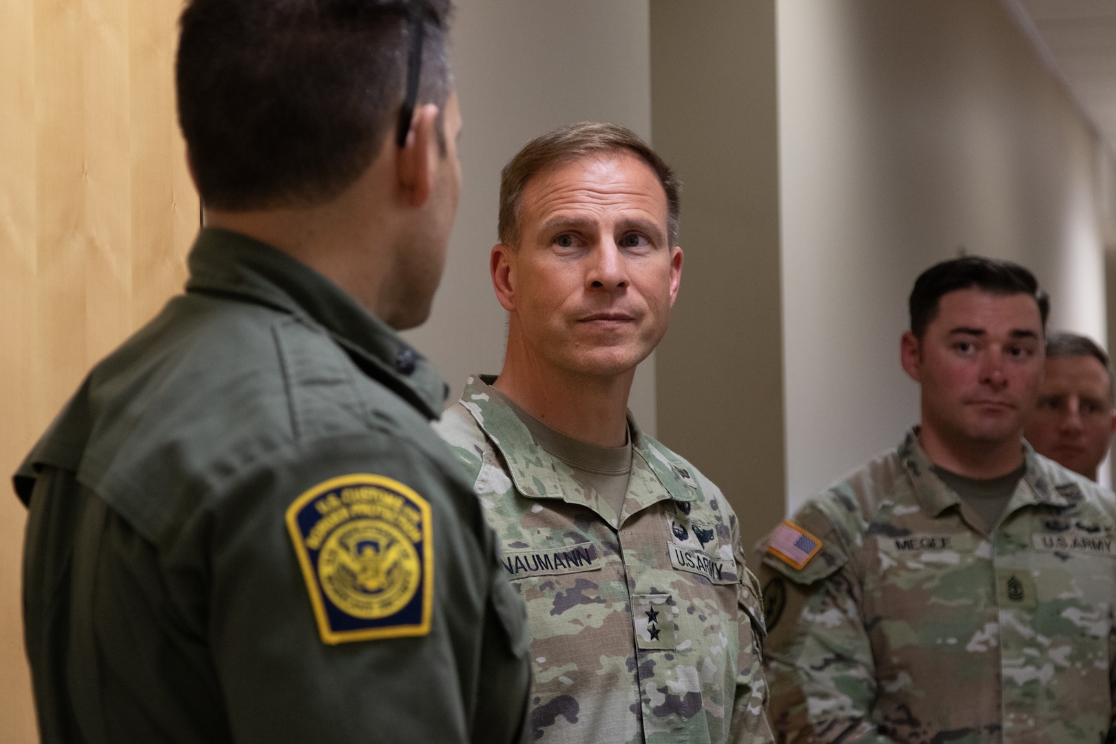 U.S. Army Soldier meeting Border Patrol member.