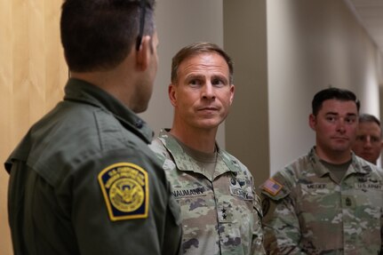 U.S. Army Soldier meeting Border Patrol member.