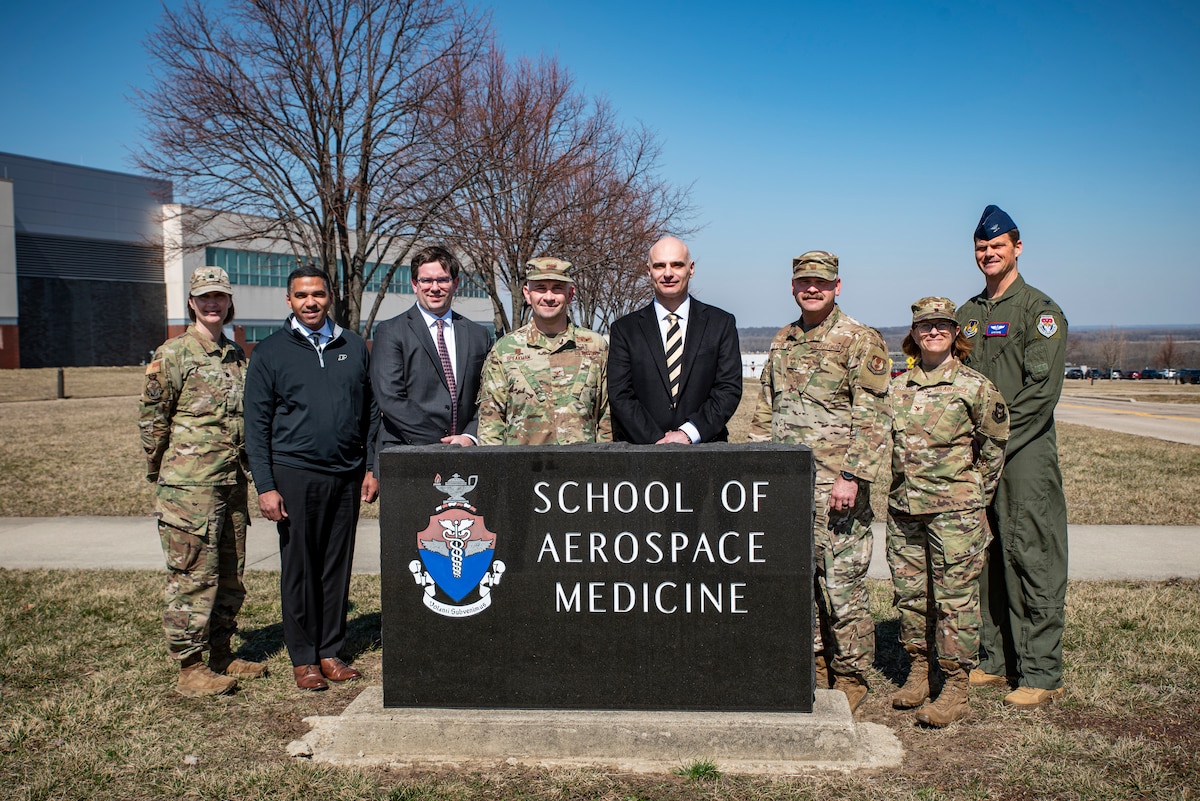 Leaders from the U.S. Air Force School of Aerospace Medicine, or USAFSAM, and Purdue University pose during a tour of several 711th Human Performance Wing facilities at Wright-Patterson Air Force Base, Ohio, March 11, 2025. USAFSAM hosted Purdue leaders in honor of a new partnership that expands educational opportunities for Airmen and Guardians. (U.S. Air Force photo / Richard Eldridge)
