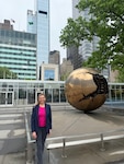 Sarah Gamberini standing in front of the United Nations Headquarters in New York.