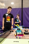 Teammates watch as their constructed robot navigates a challenge, April 29, 2025, during the 3rd Annual Navy Peninsula Robotics Competition at North Kitsap High School in Poulsbo, Washington. (U.S. Navy photo by Jeb Fach)