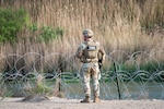 A U.S. Soldier with the Texas Army National Guard monitors activity along the Rio Grande during a patrol near Roma, Texas, April 25, 2025. Texas Army Guard members are part of Operation Lone Star, working alongside U.S. Border Patrol agents to deter illegal crossings and disrupt transnational criminal activity along the Texas-Mexico border.