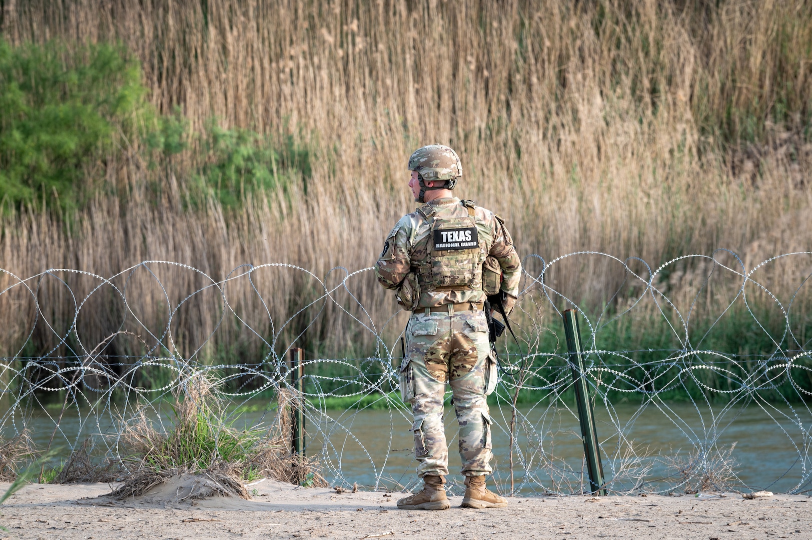 A U.S. Soldier with the Texas Army National Guard monitors activity along the Rio Grande during a patrol near Roma, Texas, April 25, 2025.