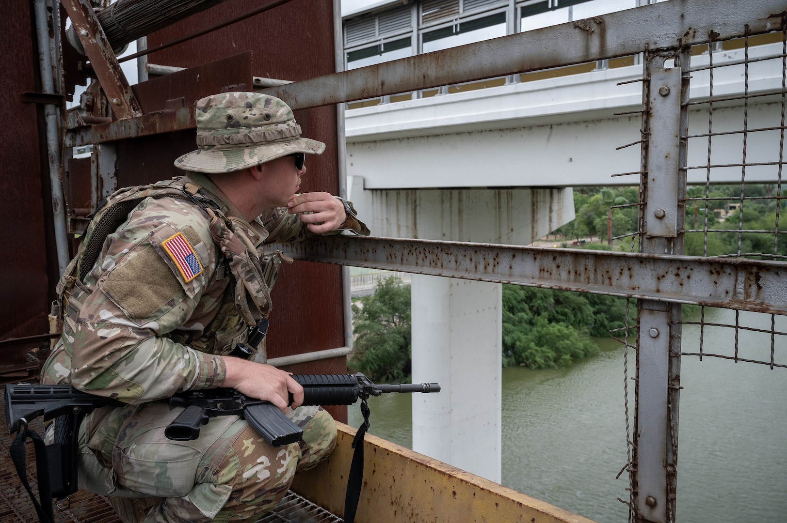 A U.S. Soldier with the Texas Army National Guard monitors activity along the Rio Grande during a patrol near Roma, Texas, April 24, 2025.