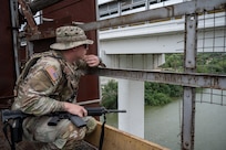 A U.S. Soldier with the Texas Army National Guard monitors activity along the Rio Grande during a patrol near Roma, Texas, April 24, 2025.