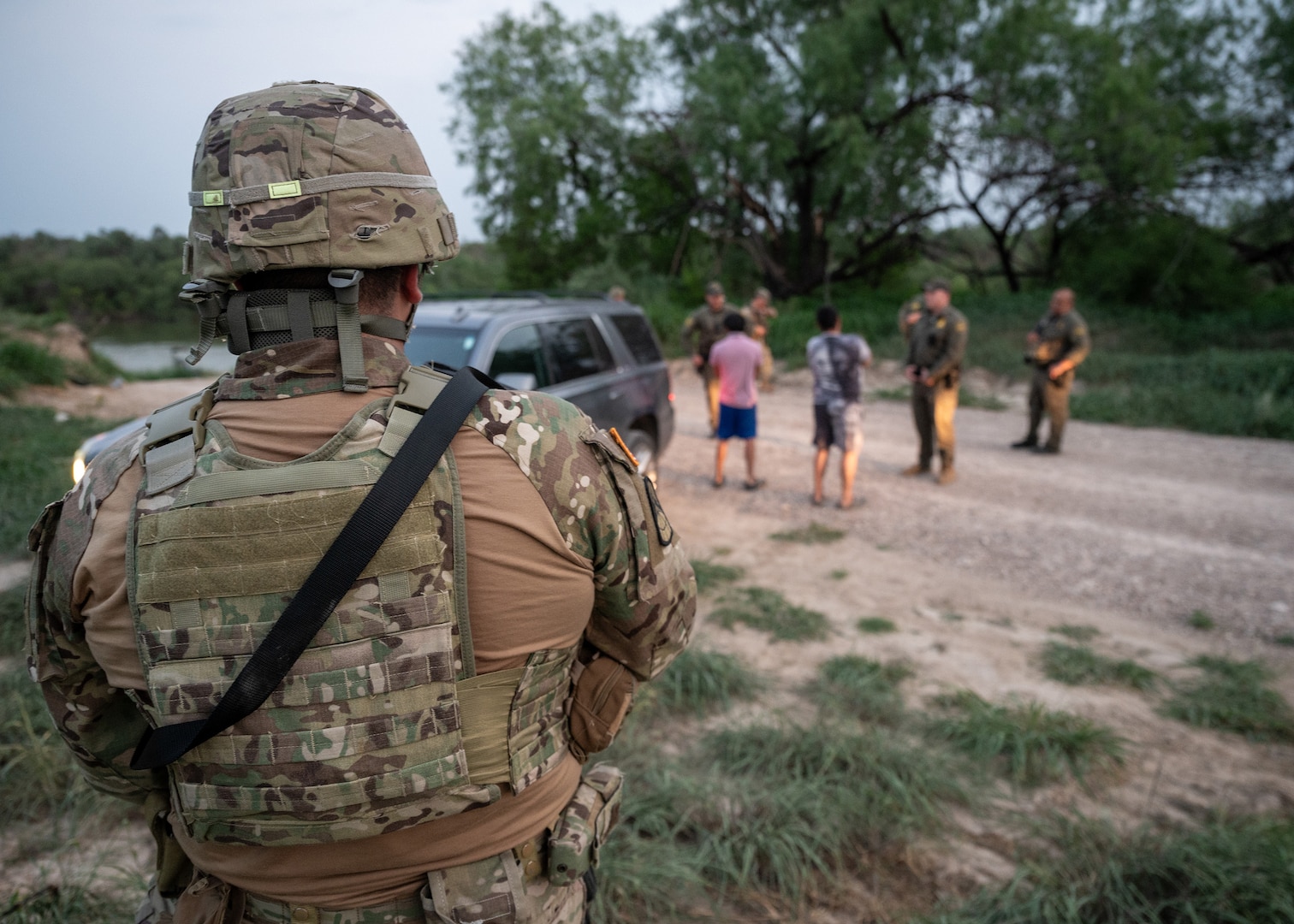 A U.S. Soldier with the Texas Army National Guard watches as U.S. Border Patrol agents conduct a traffic stop near the Rio Grande during a patrol near Roma, Texas, April 23, 2025.