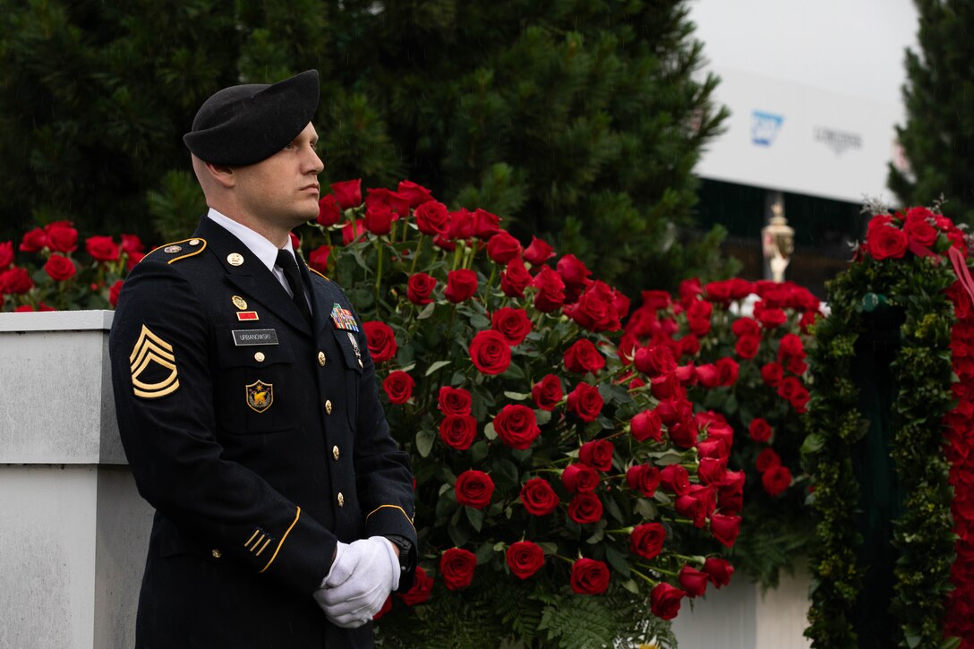 Sgt. 1st. Class Joshua Urbanowski of the 438th Military Police Company, 198th Military Police Battalion, guards the Kentucky Derby Trophy during the 151st running of the Kentucky Derby at Churchill Downs in Louisville, Kentucky, May 3, 2025. Urbanowski volunteered for the duty, which has been carried out by Kentucky National Guard service members for 119 years. (U.S. Army National Guard photo by Sgt. Caleb Sooter)
