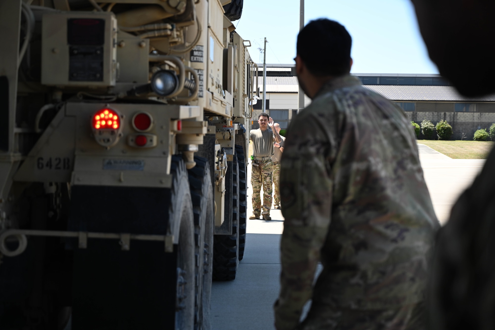 Airmen and Soldiers work together to static load.