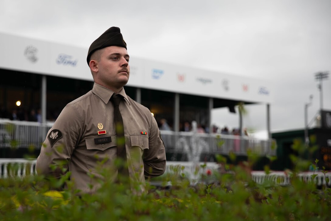 Spc. Ryan Hayden of the 438th Military Police Company renders honors during a race during the 151st running of the Kentucky Derby at Churchill Downs in Louisville, Kentucky, May 3, 2025. Service members from almost every branch were present during the Derby to post near the finish line. (U.S. Army National Guard photo by Sgt. Caleb Sooter)