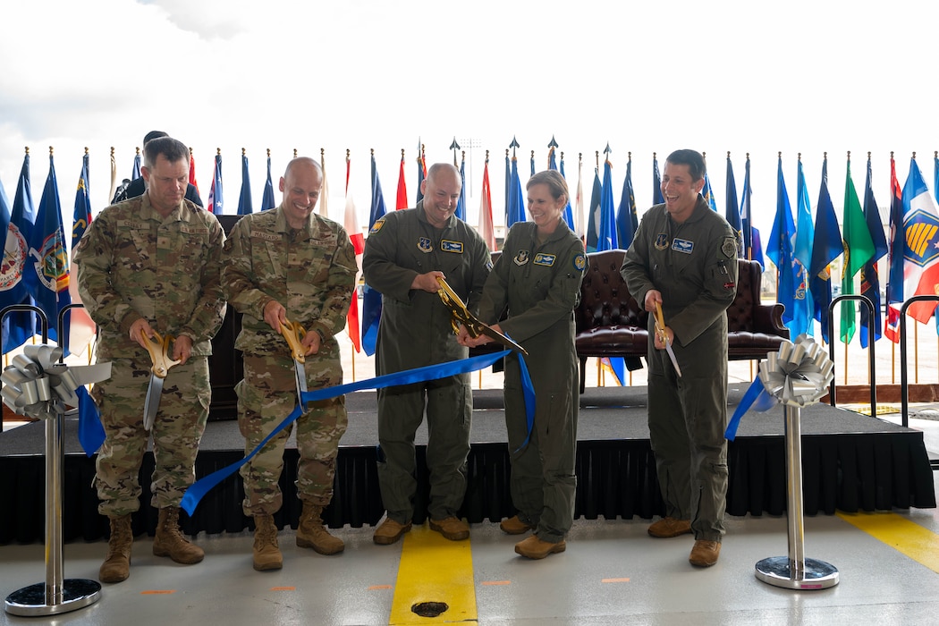 Air Force leaders cut a ribbon during a ceremony.