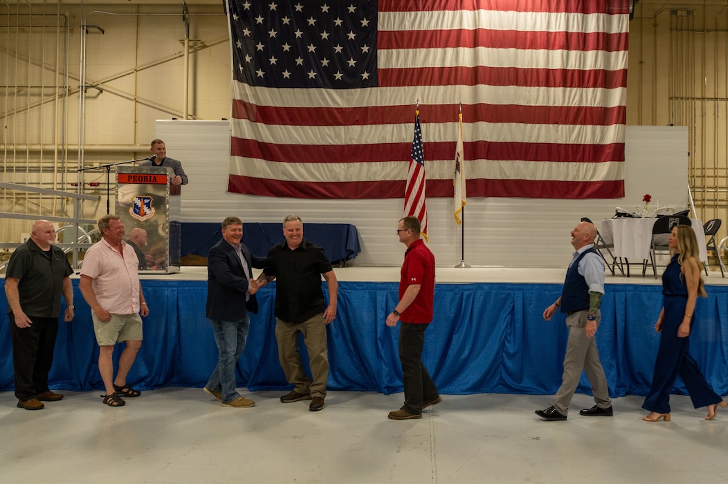 Airmen attend the 2025 retirement dinner at the 182nd Airlift Wing.