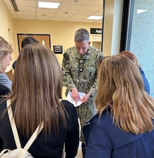 250430-N-TY711-1407 SIGONELLA, Italy. (April 30, 2025) Commander Sebastian Lara, the Pediatrician assigned to U.S. Naval Hospital (USNH) Sigonella, discussing qualification criteria for therapeutic hypothermia for hypoxic ischemic encephalopathy with a group of Italian neonatologists and neonatal nurses visiting USNH Sigonella. The visit was prompted by a recent neonatal case in which two Italian hospitals collaborated with USNH Sigonella in the continuum of care for a premature newborn. (U.S. Navy photo by Lieutenant Commander Brandi Gibson)