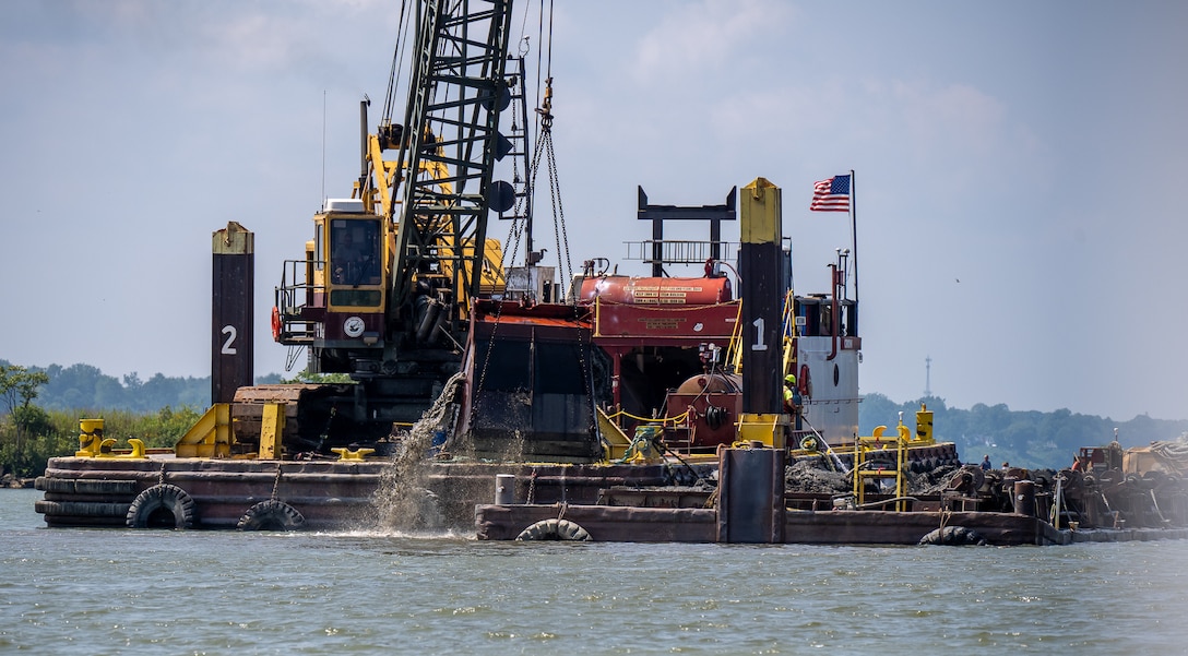 A crane barge conducts dredging in Ashtabula Harbor, Ohio