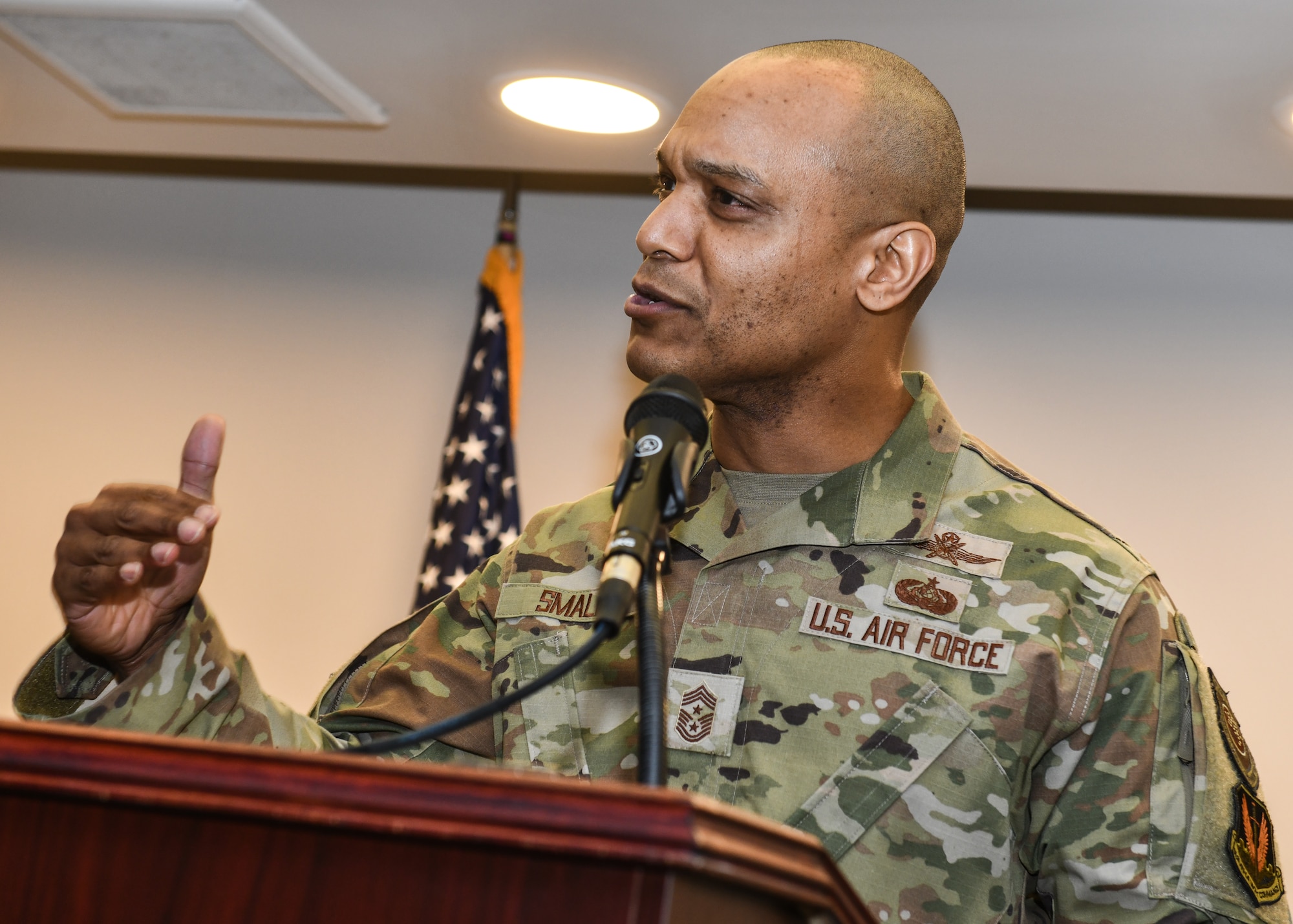 Chief Master Sgt. Andrew Small, 55th Wing command chief, speaks to attendees during the kickoff of Offutt Air Force Base's 2025 Air Force Assistance Fund campaign, May 2. Chief Small related his experiences as a young Airman who needed to utilize AFAF. (U.S. Air Force photo by Chad Watkins)