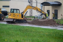 Photo of machine digging lines