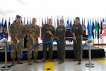 From left: U.S. Air Force Brig. Gen. Richard Coffey, assistant adjutant general – Air, Florida National Guard, Brig. Gen. Mark A. Massaro, commander, 96th Test Wing, Air Force Materiel Command, Maj. Gen. Duke Pirak, deputy director, Air National Guard (ANG), Maj. Gen. Regina A. Sabric, commander, 10th Air Force, and Col. Daniel J. Wittmer, commander, ANG Air Force Reserve Command Test Center, cut a ribbon during a ceremony at Eglin Air Force Base, Florida, May 1, 2025. The ceremony established the first-ever F-35 Combined Test Force at Eglin, ensuring the Air Reserve Component as a key player in fifth-generation fighter aircraft testing.  (U.S. Air National Guard photo by Tech. Sgt. Richard Mekkri)
