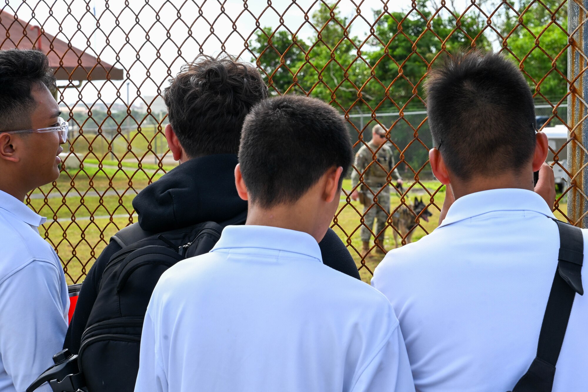 George Washington High School pre-engineering students and Father Duenas Memorial School Junior Reserve Officers’ Training Corps students tour Andersen Air Force Base, Guam, May 2, 2025. HSC-25 members showcased the MH-60S Sea Hawk while explaining day to day life as pilots, rescue swimmers, maintenance and more as part of a base tour. (U.S. Air Force photo by Senior Airman Audree Campbell)