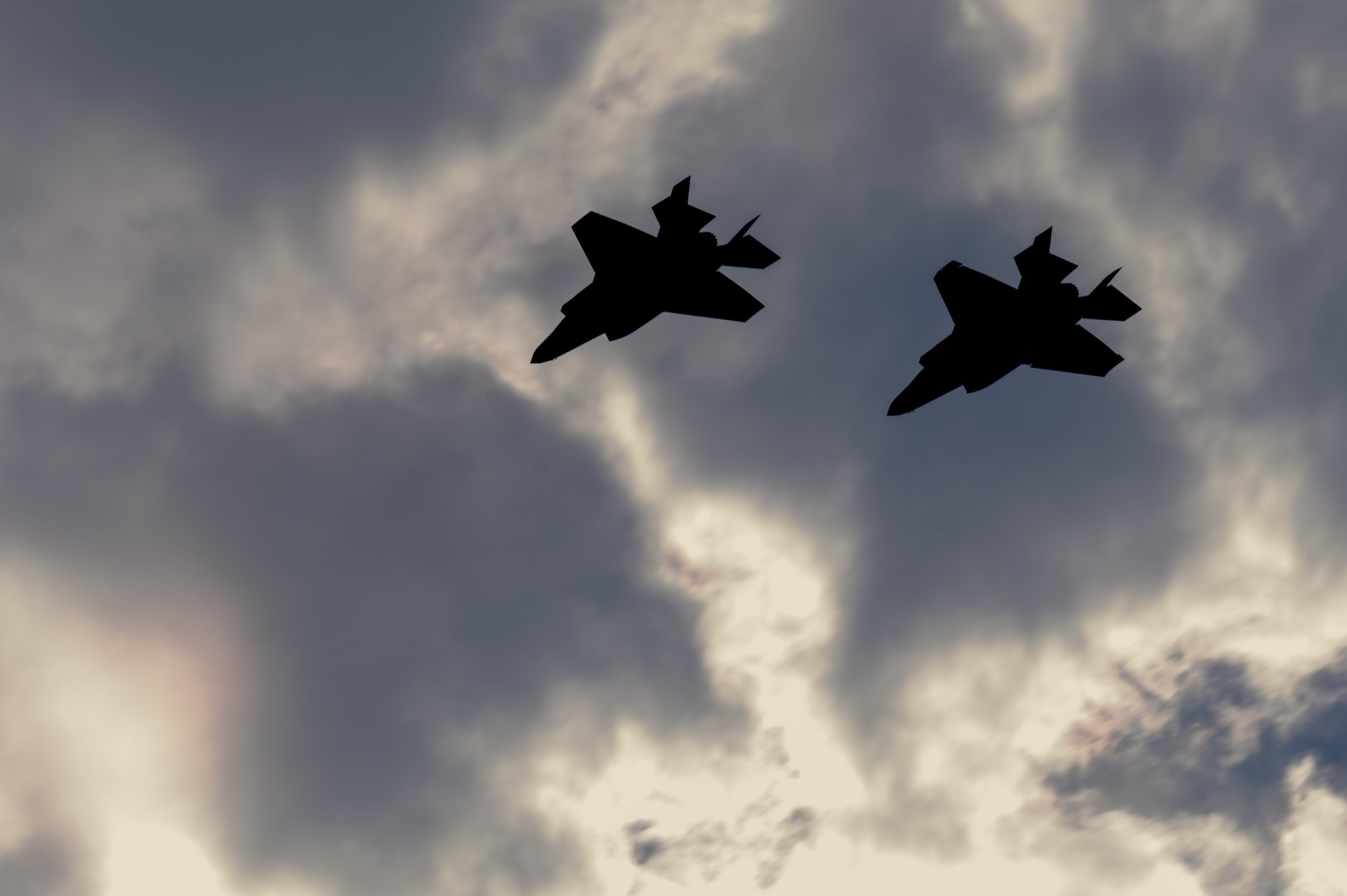 Two U.S. Air Force F-35A Lightning IIs assigned to the 355th Expeditionary Fighter Squadron prepare to land at Marine Corps Air Station Futenma, Japan during a routine 18th Wing readiness exercise at Kadena Air Base, Japan, May 6, 2025.