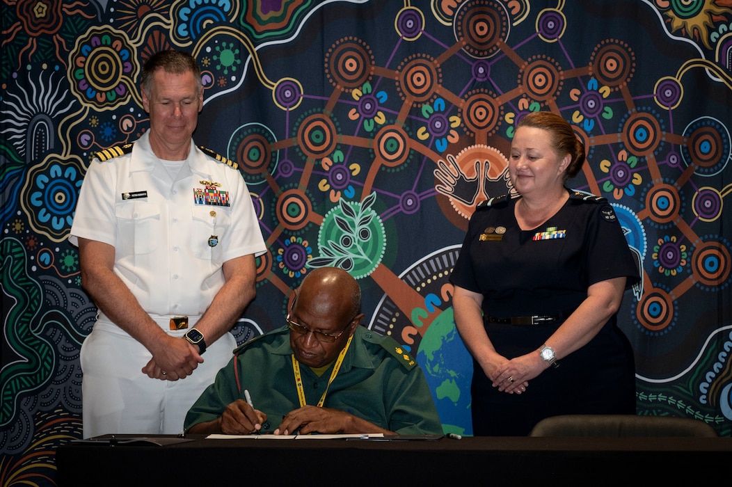U.S. Navy Capt. Peter Roberts, U.S. Indo-Pacific Command Command Surgeon, Papua New Guinea Defence Force Lt. Col Peter Kaminiel, PNGDF Director General, and Royal Australian Air Force Air Commodore Nicole dos Santos, RAAF Director General Operational Health and Air Force Health Service, sign the Terms of Reference at the Indo-Pacific health security alliance in Port Moresby, Papua New Guinea, May 8, 2025. IPHSA aims to foster partnerships, counter harmful influences and enhance readiness, contributing to stability, prosperity and a free and open Indo-Pacific. (U.S. Army Photo by Sgt. Austin Riel)