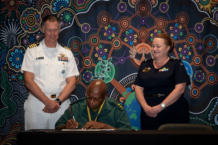 U.S. Navy Capt. Peter Roberts, U.S. Indo-Pacific Command Command Surgeon, Papua New Guinea Defence Force Lt. Col Peter Kaminiel, PNGDF Director General, and Royal Australian Air Force Air Commodore Nicole dos Santos, RAAF Director General Operational Health and Air Force Health Service, sign the Terms of Reference at the Indo-Pacific health security alliance in Port Moresby, Papua New Guinea, May 8, 2025. IPHSA aims to foster partnerships, counter harmful influences and enhance readiness, contributing to stability, prosperity and a free and open Indo-Pacific. (U.S. Army Photo by Sgt. Austin Riel)