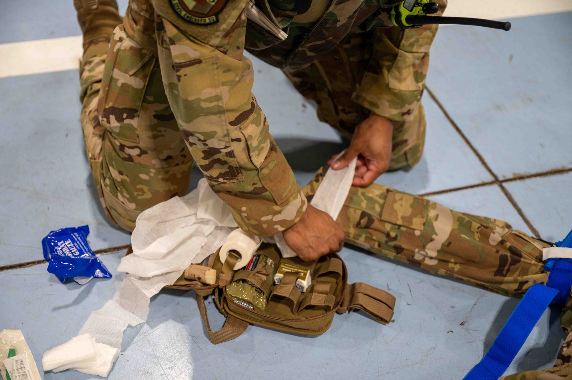 Service member performs Tactical Combat Casualty Care on a simulated patient