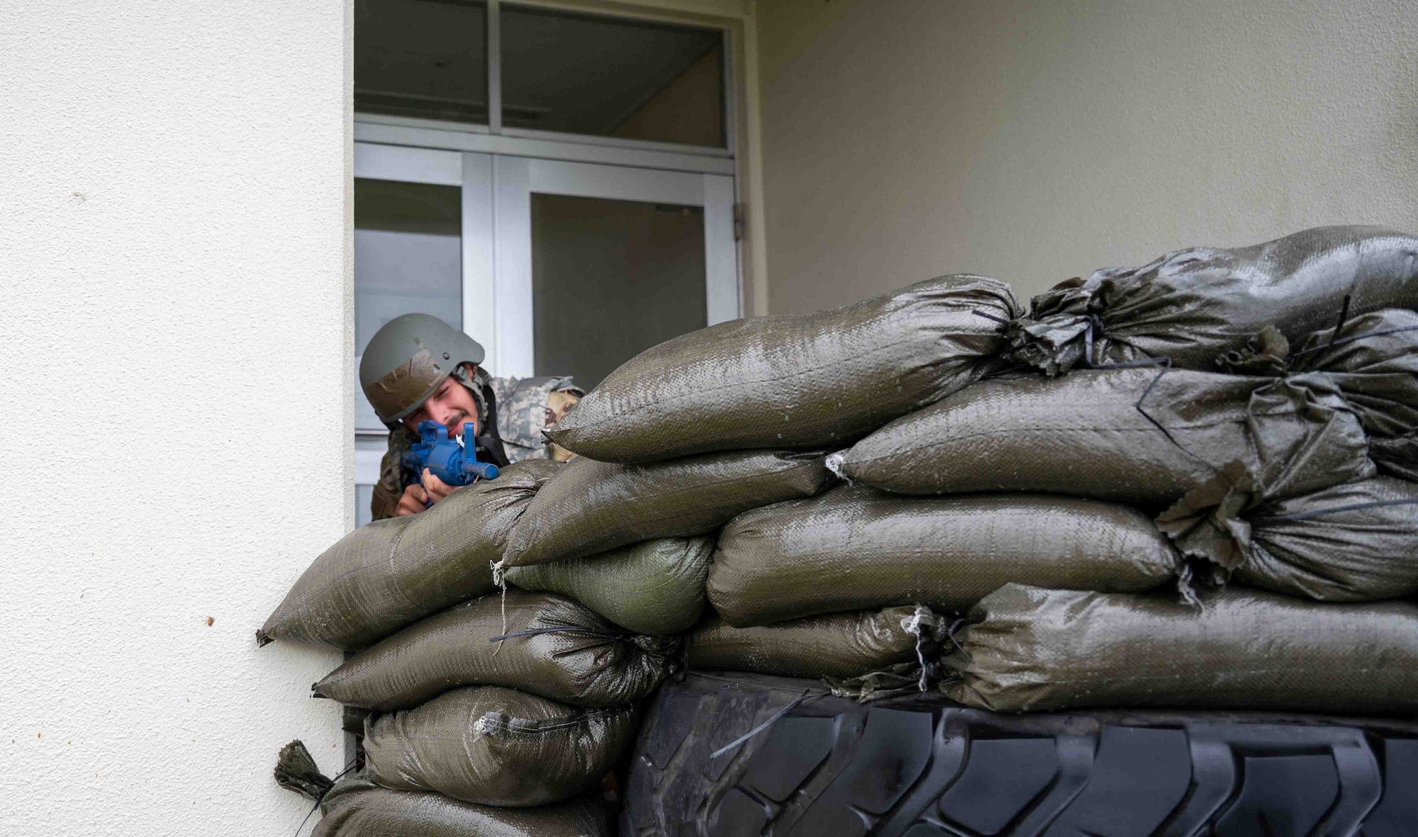 Service member on bags of sand participating in the exercise.