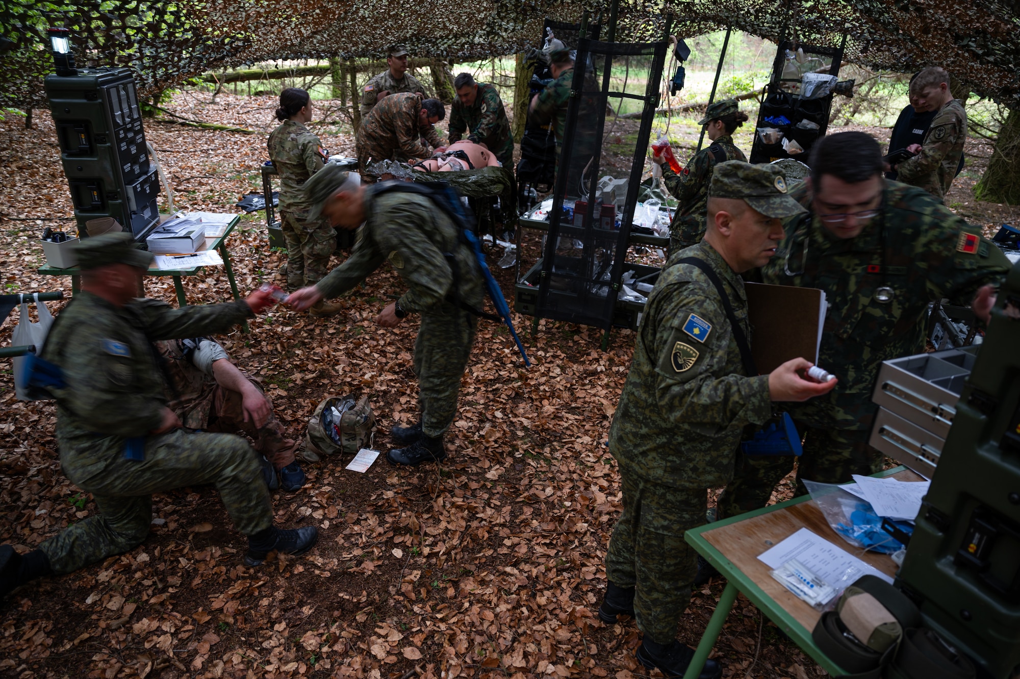 Military medical professionals from Kosovo, Armenia, Albania and Moldova, simulate performing final stages of care to a mannequin at Landstuhl, Germany, April 25, 2025. The event was a joint effort between The U.S. Air Forces in Europe – Air Forces Africa Global Health Engagement team and the U.S. Army’s European Medical Simulation Center. A critical part of their mission is to enhance interoperability by helping partner nations build up their own health system capabilities. (U.S. Air Force photo by Senior Airman Jared Lovett)