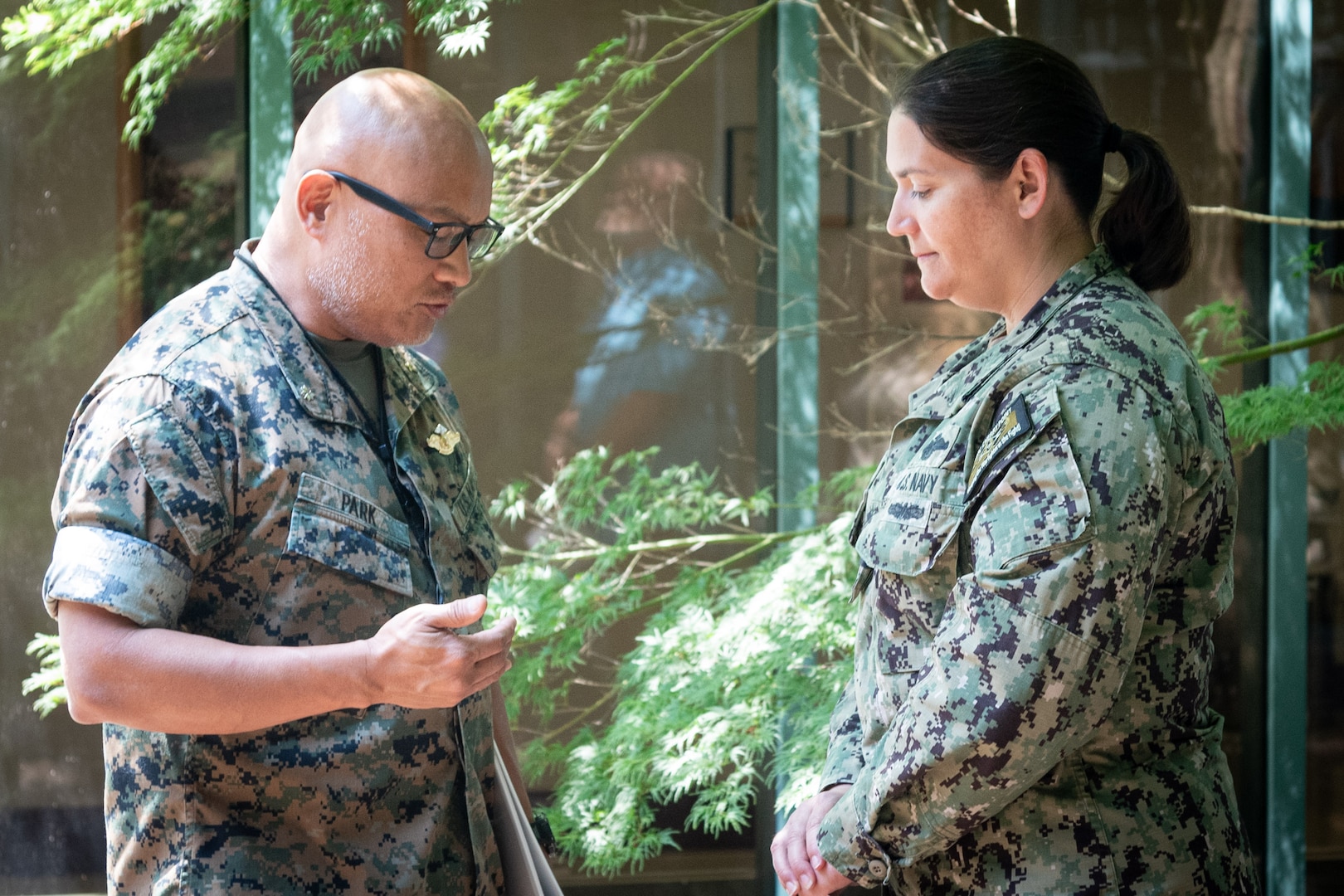 Commander Stacey Swindells, right, a Nurse serving aboard Naval Health Clinic Cherry Point, prays with Navy Chaplain Commander Philip Park during a Blessing of the Hands ceremony Wednesday, May 7.  The spiritual fitness event honored the compassion and professionalism of the nursing staff serving in the facility while fortifying their spiritual resolve.