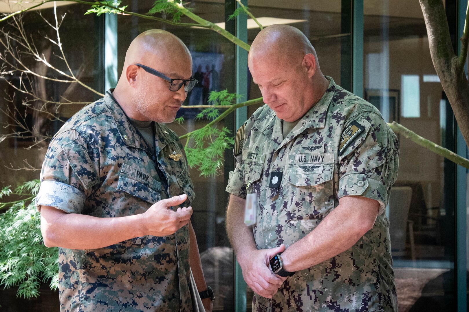 Commander Carlton W. Bennet III, right, a Nurse serving aboard Naval Health Clinic Cherry Point, prays with Navy Chaplain Commander Philip Park during a Blessing of the Hands ceremony Wednesday, May 7.  The spiritual fitness event honored the compassion and professionalism of the nursing staff serving in the facility while fortifying their spiritual resolve.