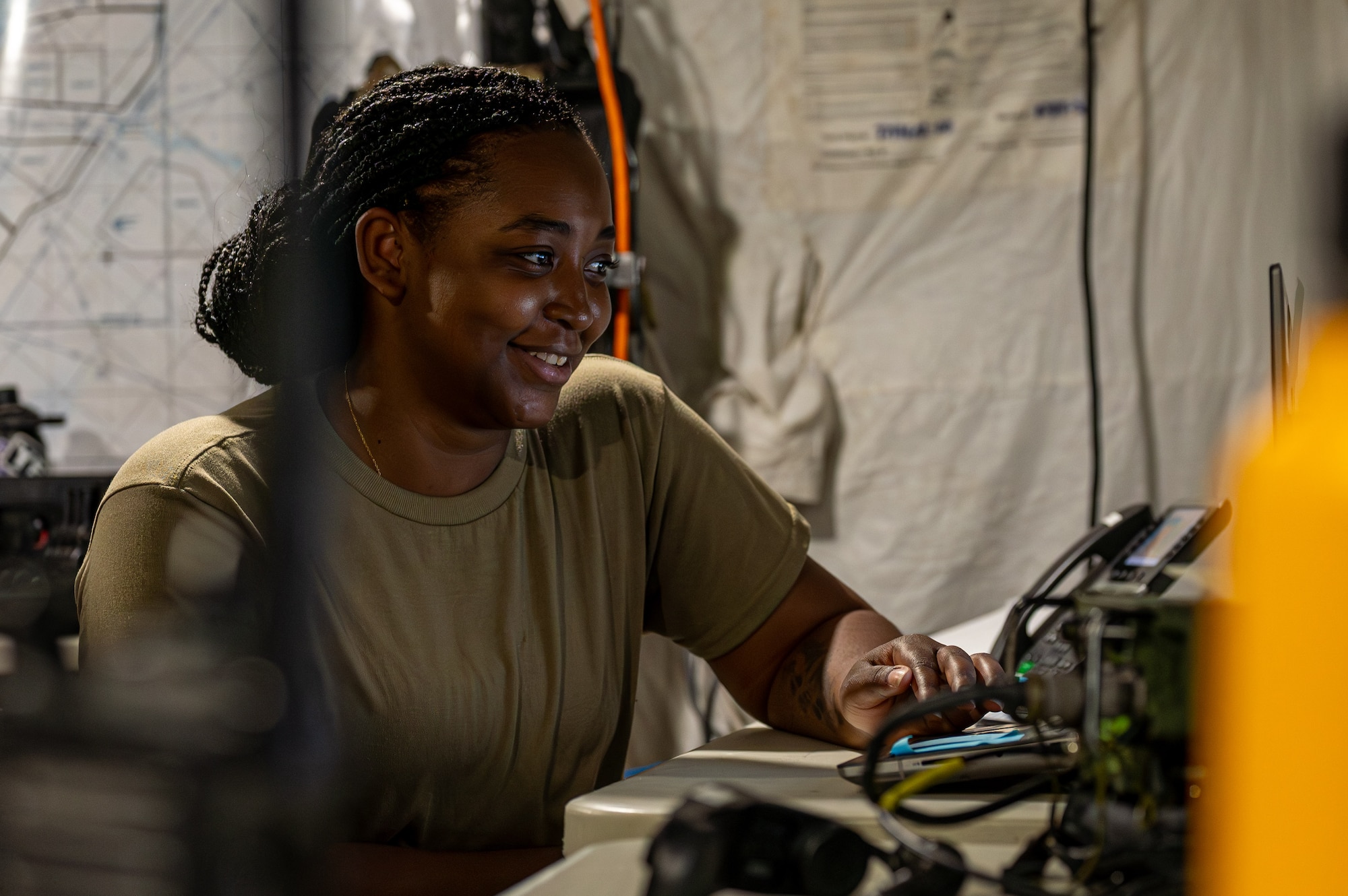 An Airman operating out of a tactical operation center at Marine Corps Air Station Futenma