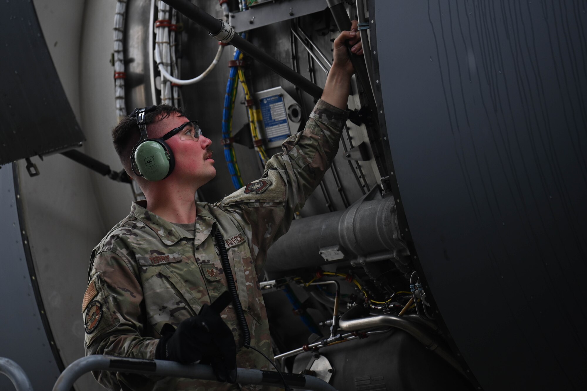 Staff Sgt. Luke Terry, a 721st Aircraft Maintenance Squadron aircraft environmental and electrical craftsman, participates in the Open/Close Engine Doors event during the 521st Air Mobility Operations Wing Mobility Vanguard 2025 at Ramstein Air Base, Germany, May 23, 2025.