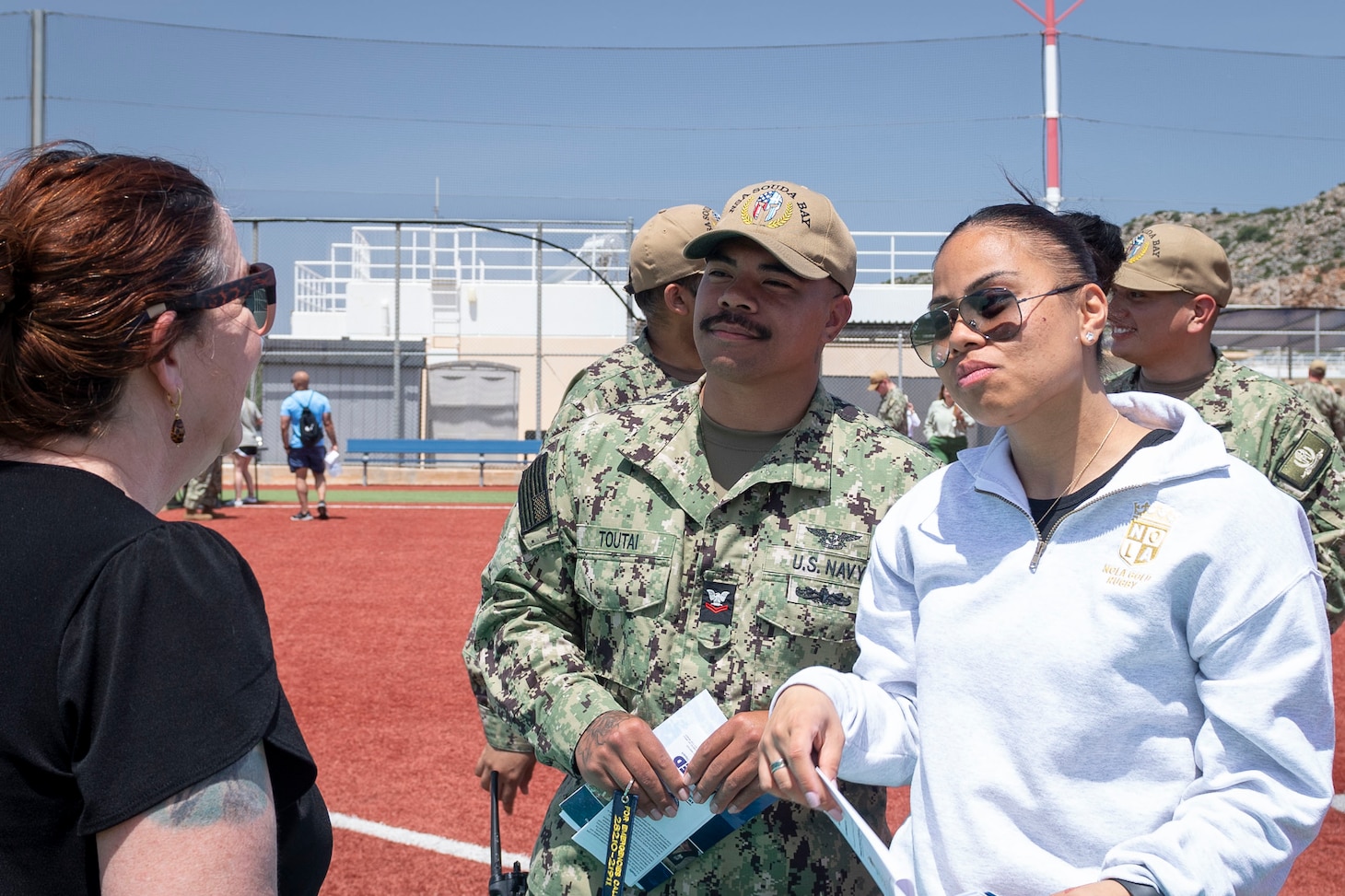 Personnel assigned to Naval Support Activity Souda Bay talks about summer safety hazards during a Summer Safety Stand Down event hosted by the NSA Souda Bay Safety Office at the base softball field on May 6, 2025.