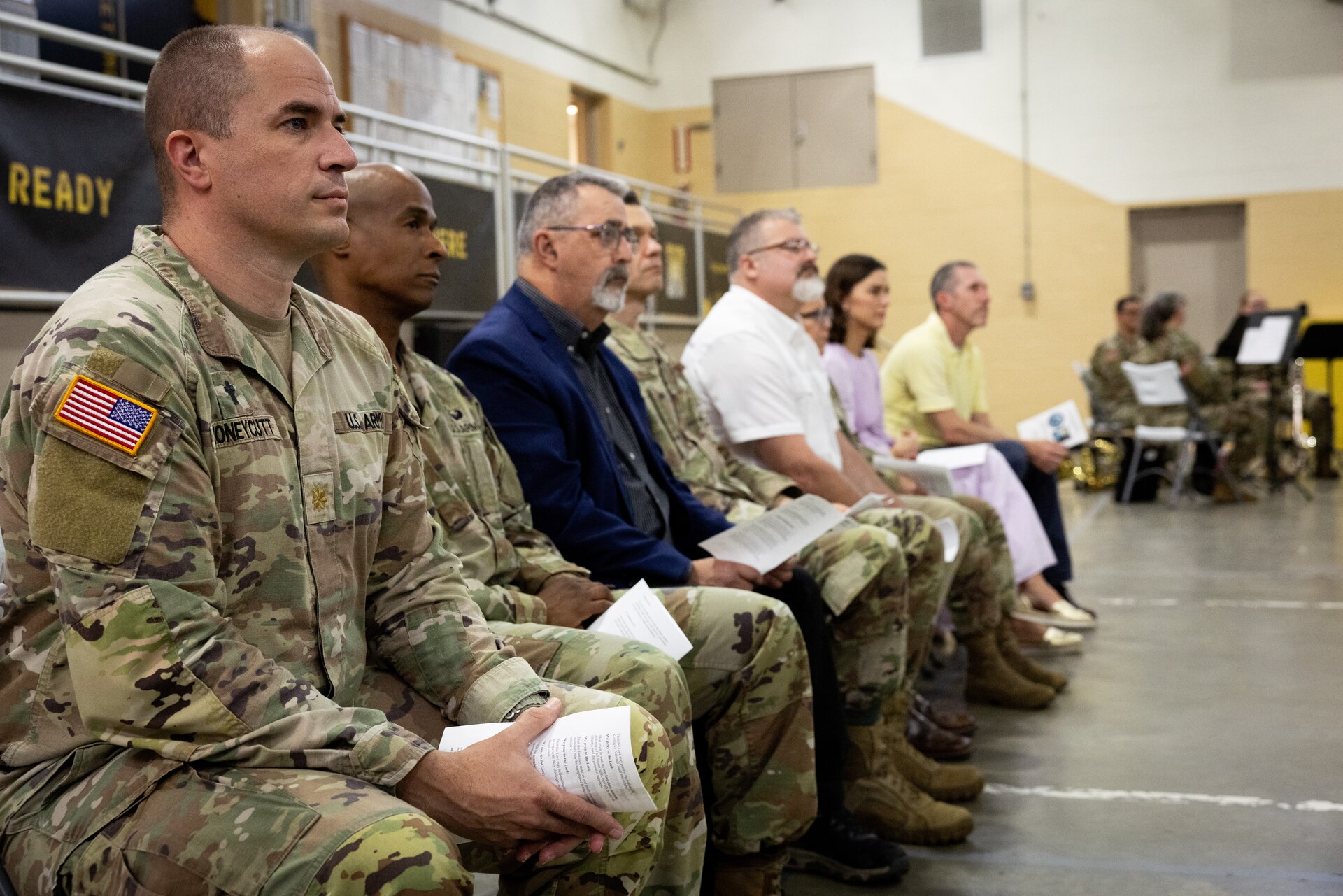 Members of the Kentucky National Guard Chaplain Corp, Kentucky Department of Military Affairs, and others listen to the history of the Kentucky National Day of Prayer event at the Wellman Armory in Frankfort, Ky. on May 1, 2025. The Kentucky National Guard held its 15th annual National Day of Prayer for service members, civilians, fallen warriors and their families at a breakfast ceremony. (U.S. Army National Guard photo by Andy Dickson)